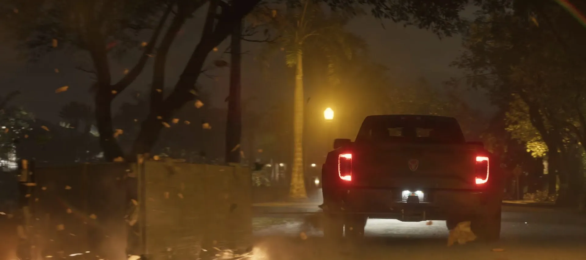 A night street, a pickup dragging a load with sparks flying